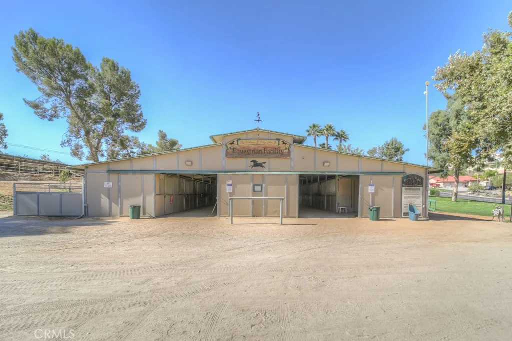 29046 Scout Canyon Lake Canyon Lake, CA 92587 - Photo 34 of 40 a front view of a house with a outdoor space and trees