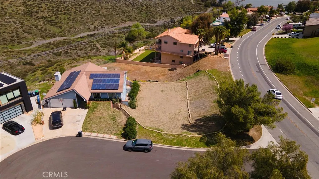 29046 Scout Canyon Lake Canyon Lake, CA 92587 - Photo 4 of 40 an aerial view of a house with a yard and lake view