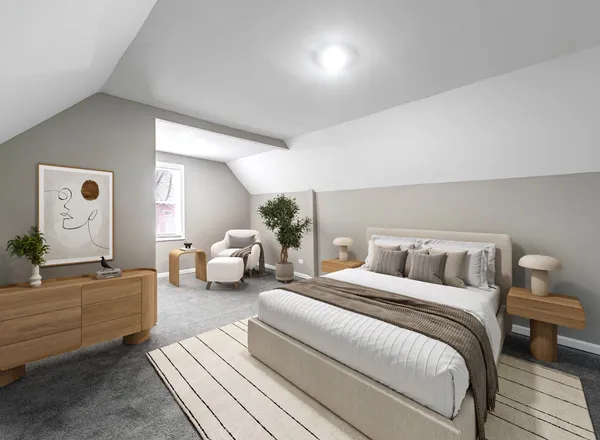 a bedroom with double bed and a couch