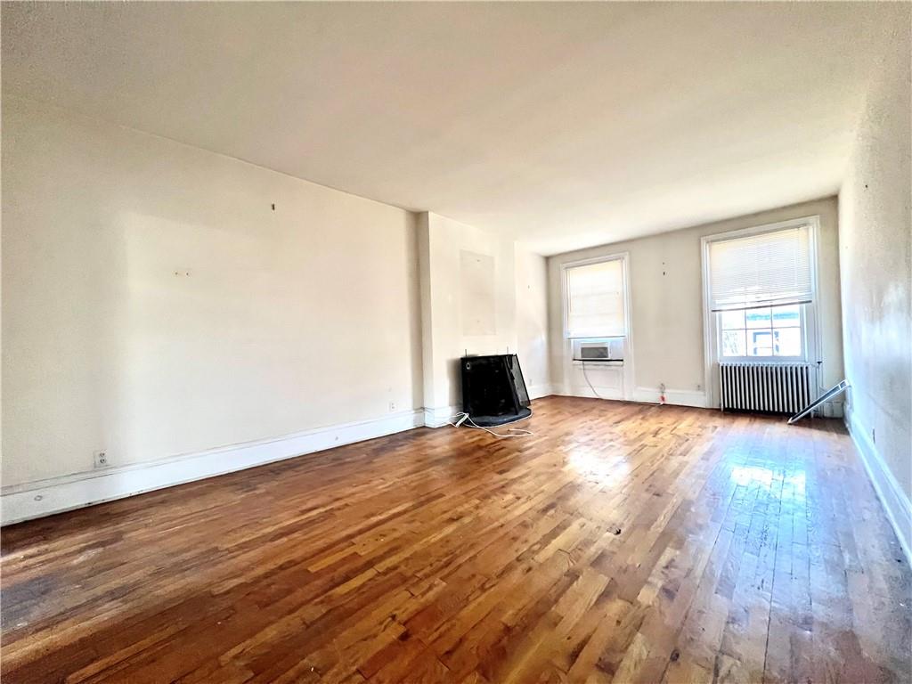 159 Bond Street Brooklyn, NY 11217 - Photo 16 of 20 a view of empty room with wooden floor and window