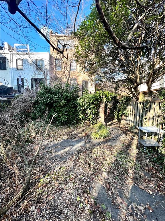 159 Bond Street Brooklyn, NY 11217 - Photo 6 of 20 a backyard of a house with lots of green space