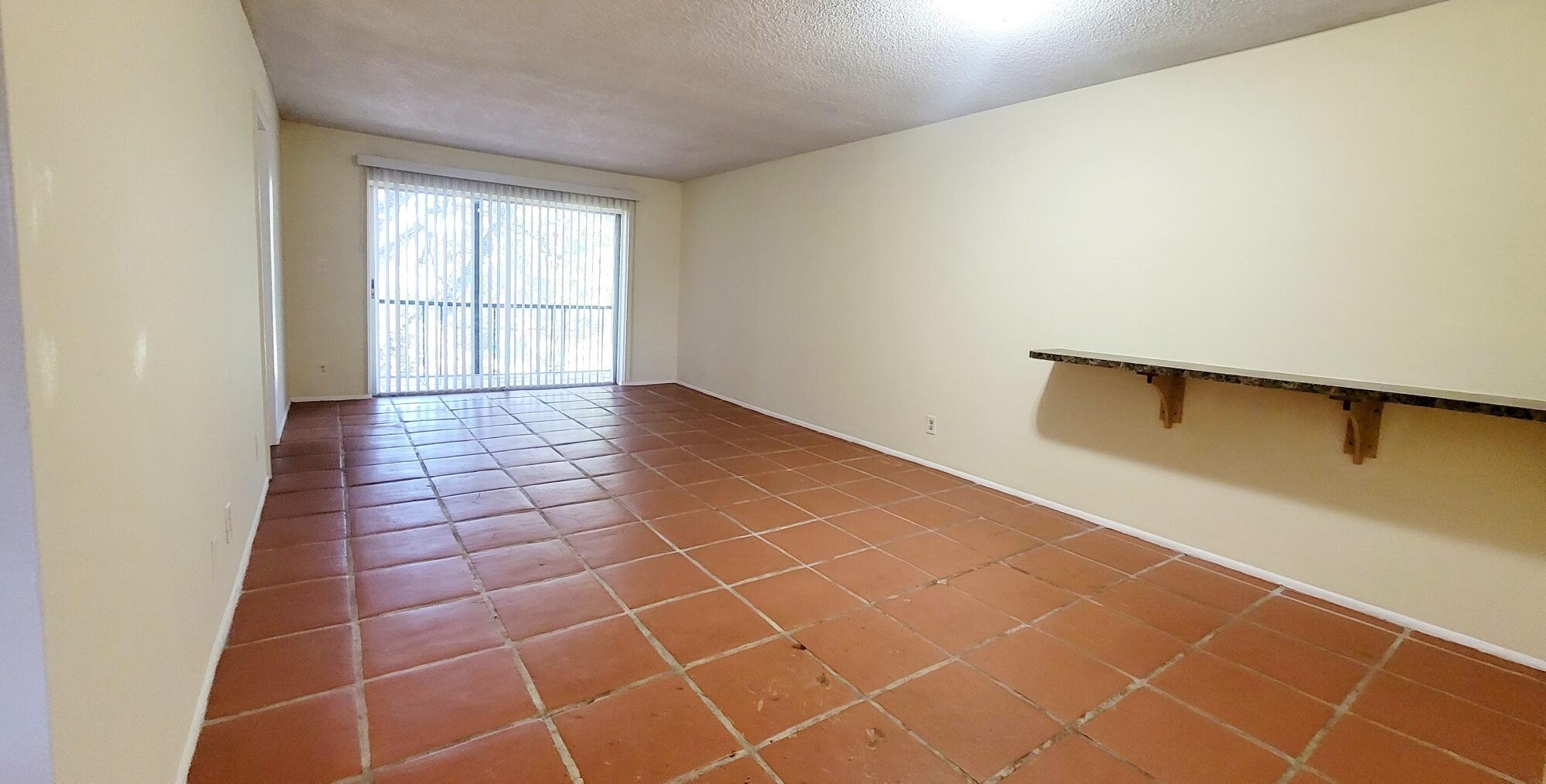 7911 North Colony Circle, Unit 305 Tamarac, FL 33321 - Photo 11 of 42 a view of an empty room with a window