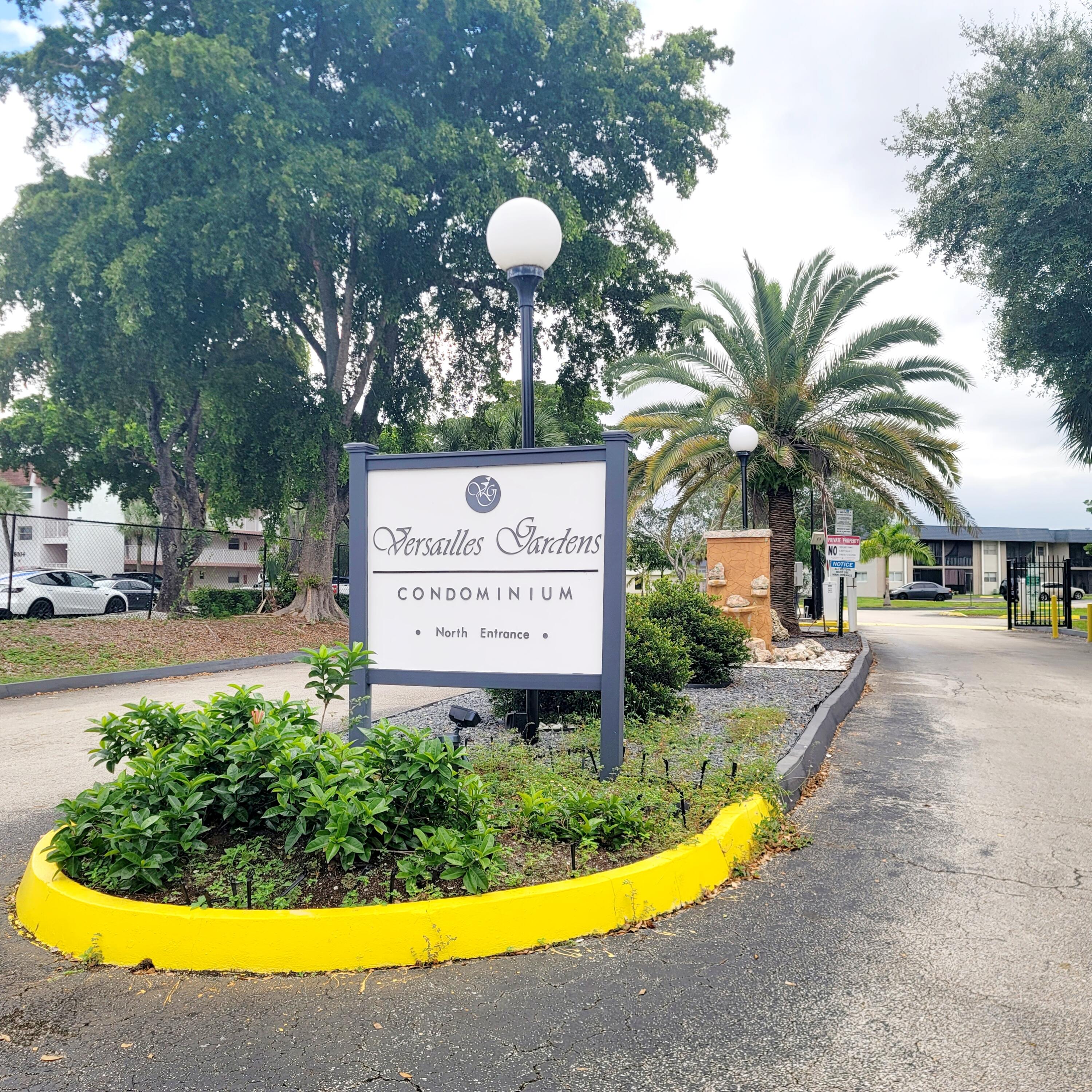 7911 North Colony Circle, Unit 305 Tamarac, FL 33321 - Photo 2 of 42 a view of a park with potted plants