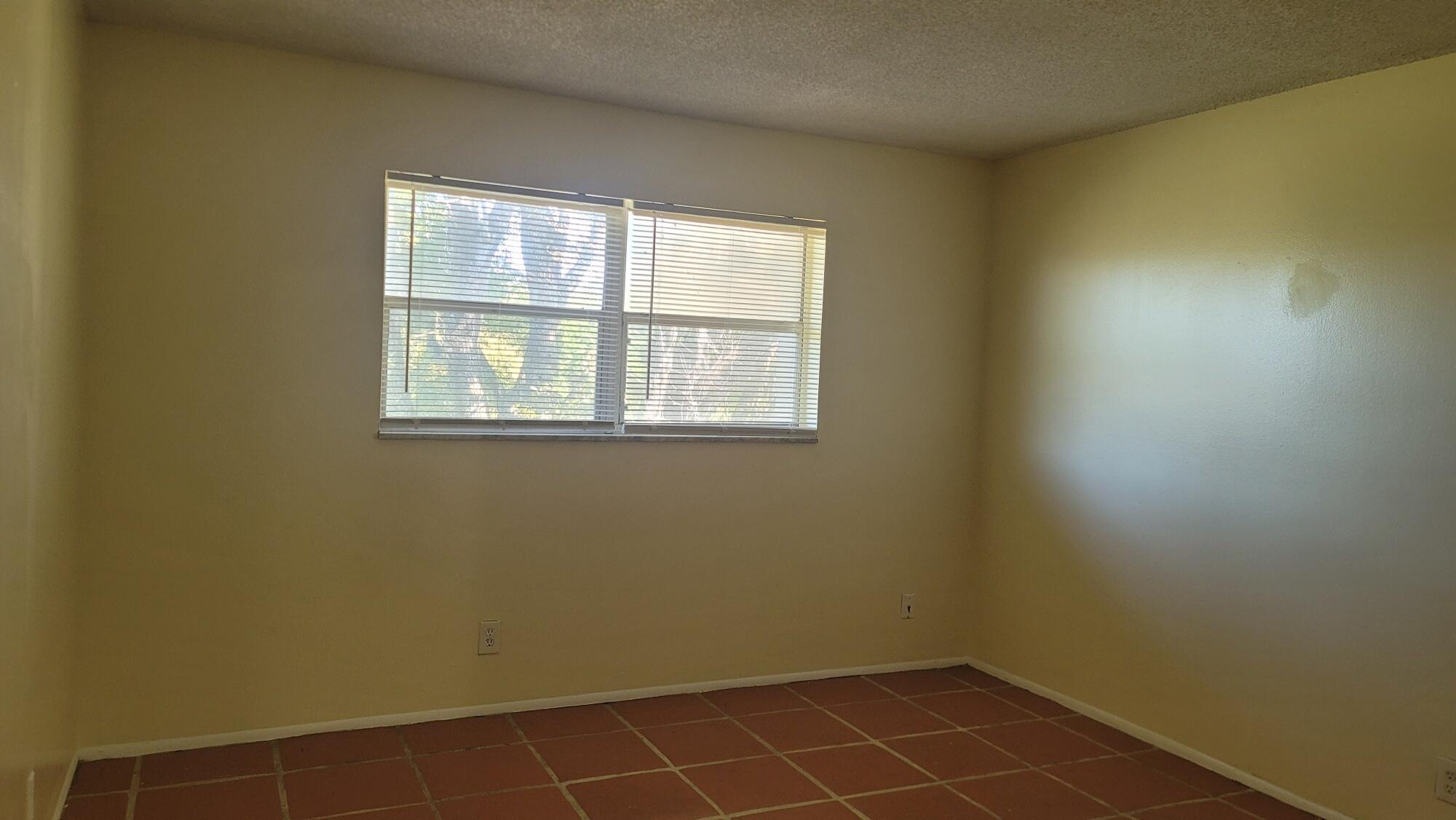 7911 North Colony Circle, Unit 305 Tamarac, FL 33321 - Photo 27 of 42 an empty room with a window
