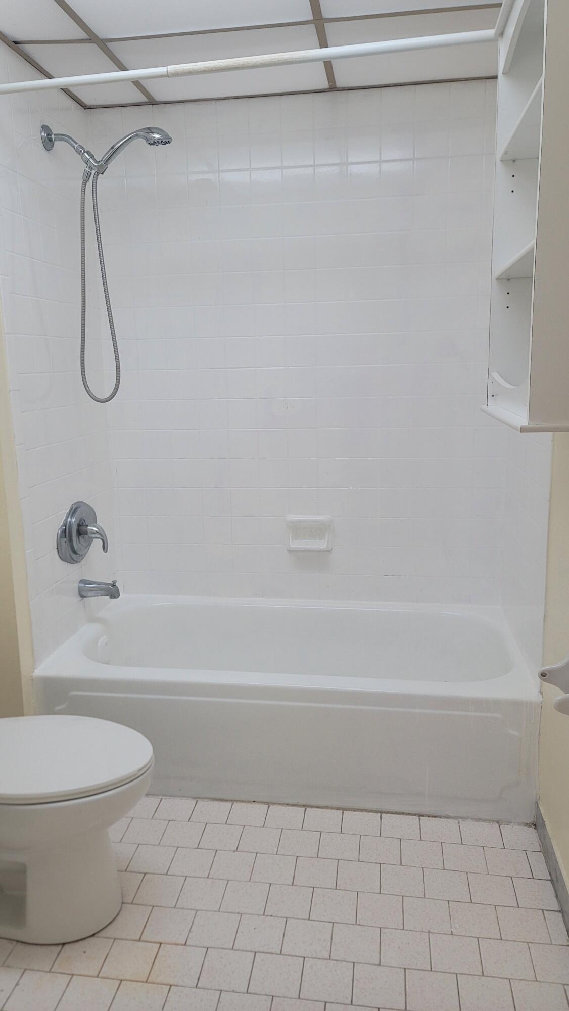 7911 North Colony Circle, Unit 305 Tamarac, FL 33321 - Photo 30 of 42 a bathroom with a toilet and a shower