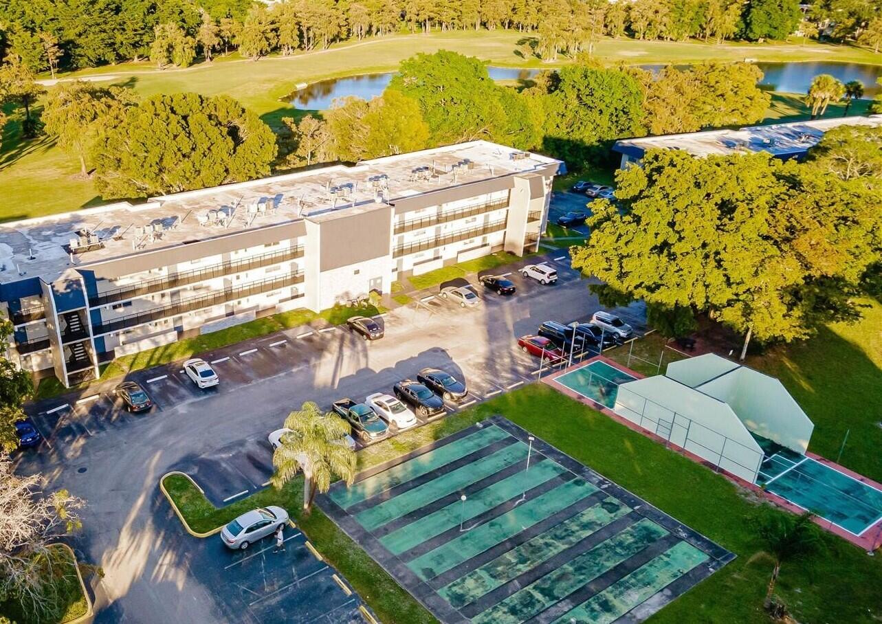 7911 North Colony Circle, Unit 305 Tamarac, FL 33321 - Photo 31 of 42 a view of an ocean with a building