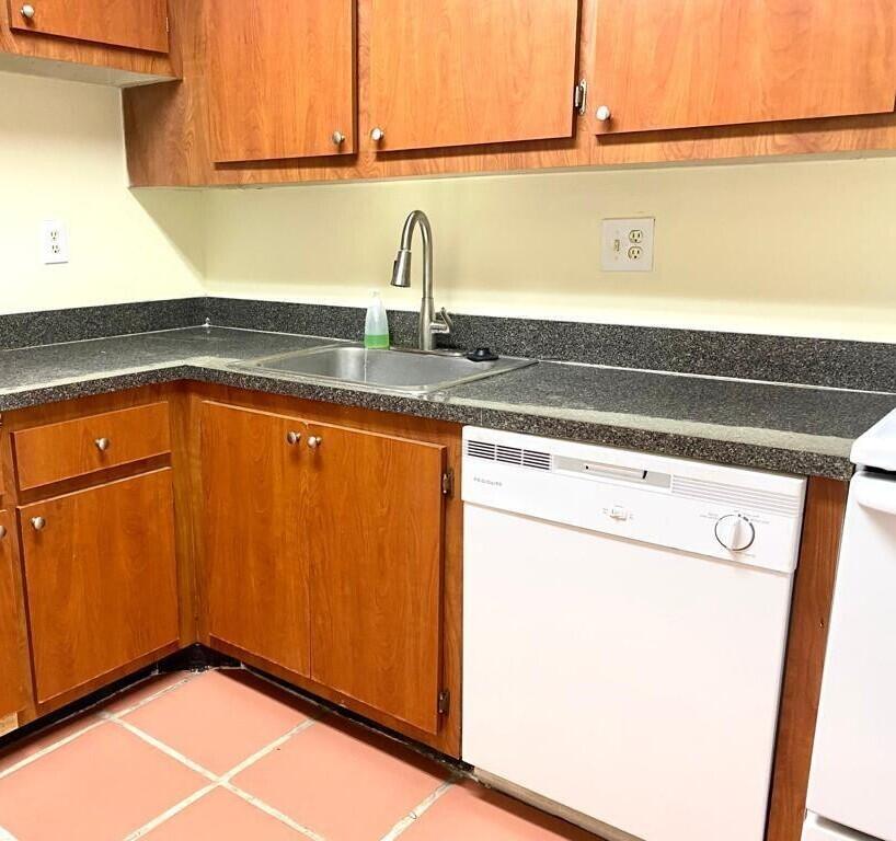 7911 North Colony Circle, Unit 305 Tamarac, FL 33321 - Photo 8 of 42 storage and utility room with a sink