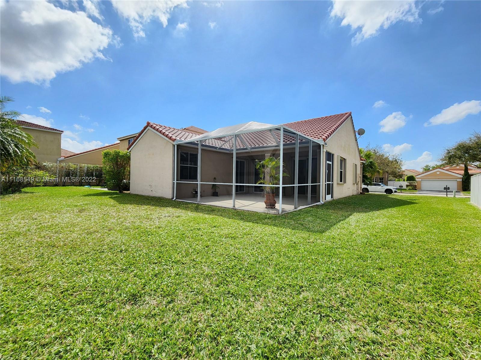 790 Falling Water Road Weston, FL 33326 - Photo 9 of 34 a view of a house with yard and sitting area