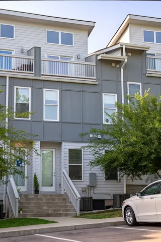a view of a car parked in front of a building
