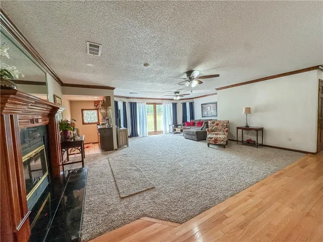 a dining room with furniture window and wooden floor