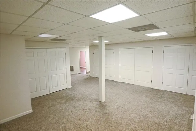a bathroom with a sink mirror vanity and toilet