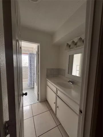 a hallway with a washer and dryer