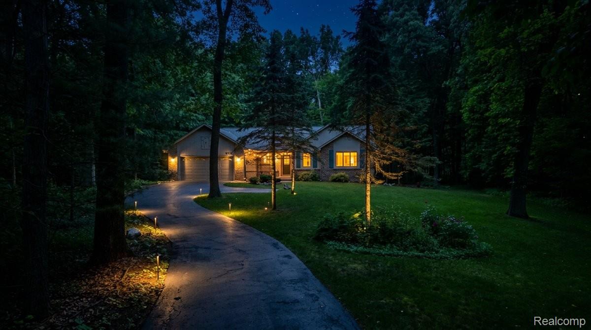 9714 Naiad Road Clarkston, MI 48348 - Photo 4 of 61 Curved driveway with integrated pathway virtual lighting.