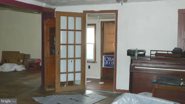 a kitchen with a refrigerator and cabinets