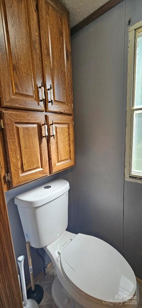 3129 Cedarvale Road Rock Hill, SC 29732 - Photo 10 of 17 a white toilet sitting next to a window