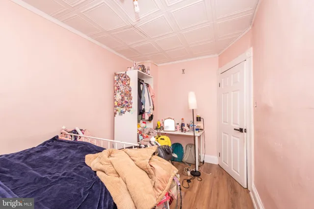 a bed room with a bed and a chair