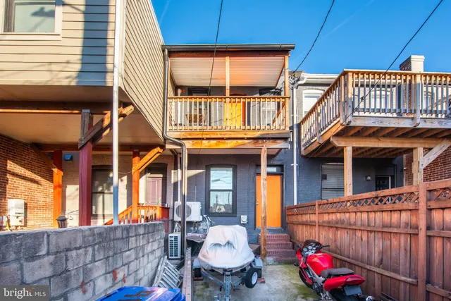 a view of a chair and table in the balcony