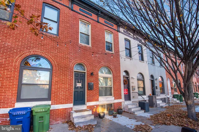 a front view of a house with outdoor space