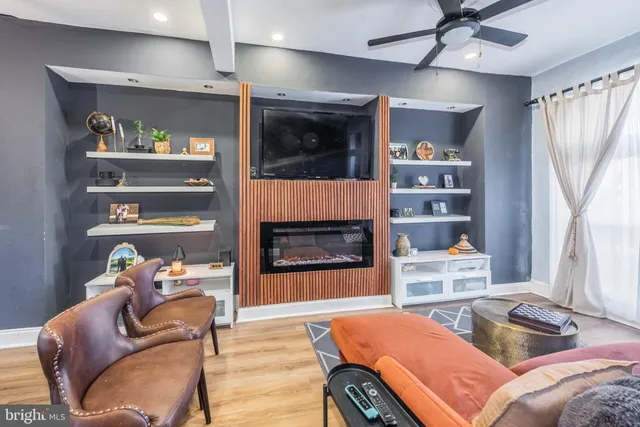 a bedroom with furniture and a fireplace