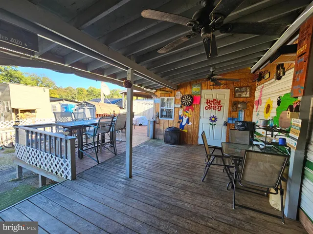 a view of sitting area with furniture and wooden floor