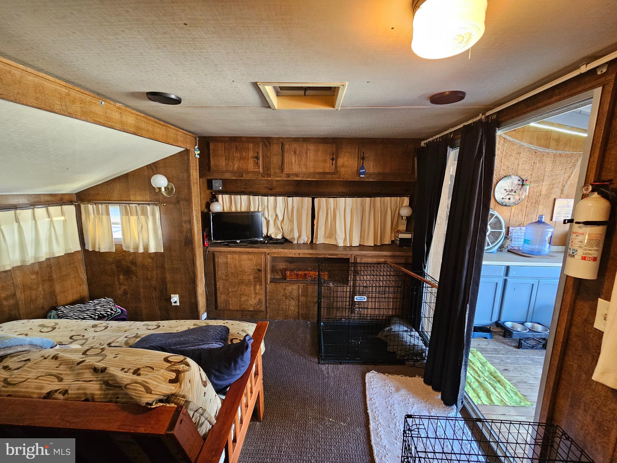 7 Poison Oak Falling Waters, WV 25419 - Photo 19 of 38 a bedroom with a bed and wooden floor