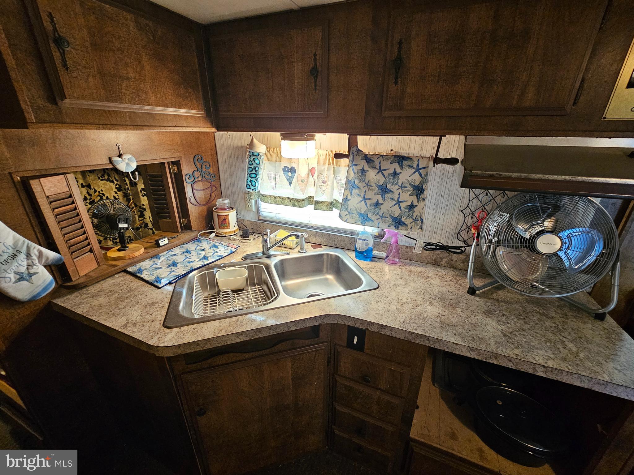 7 Poison Oak Falling Waters, WV 25419 - Photo 20 of 38 a kitchen with a sink a stove and cabinets