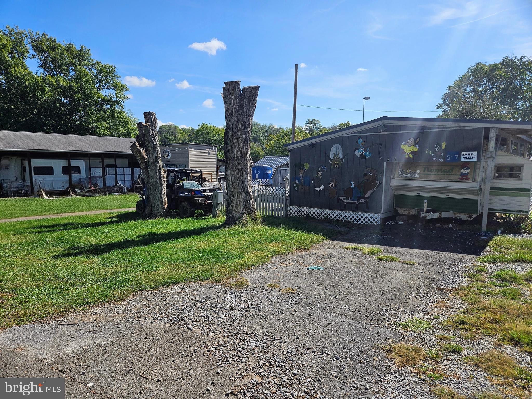 6 And 7 Poison Oak Falling Waters, WV 25419 - Photo 2 of 44 a front view of a house with garden