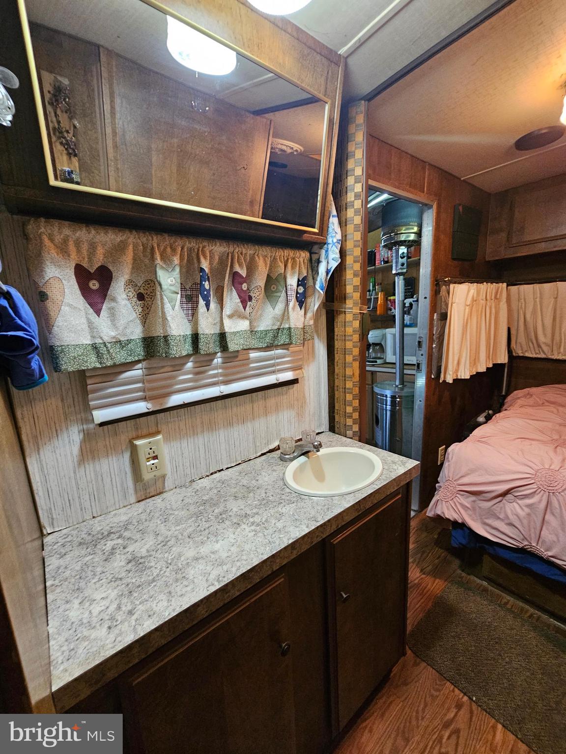 7 Poison Oak Falling Waters, WV 25419 - Photo 24 of 38 a bathroom with a sink and a mirror