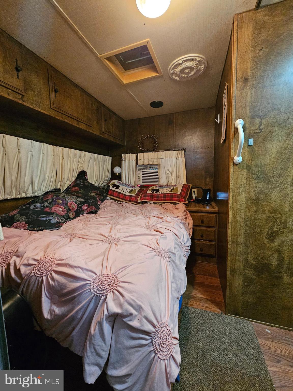 7 Poison Oak Falling Waters, WV 25419 - Photo 26 of 38 a bed sitting in a bedroom next to a bathroom