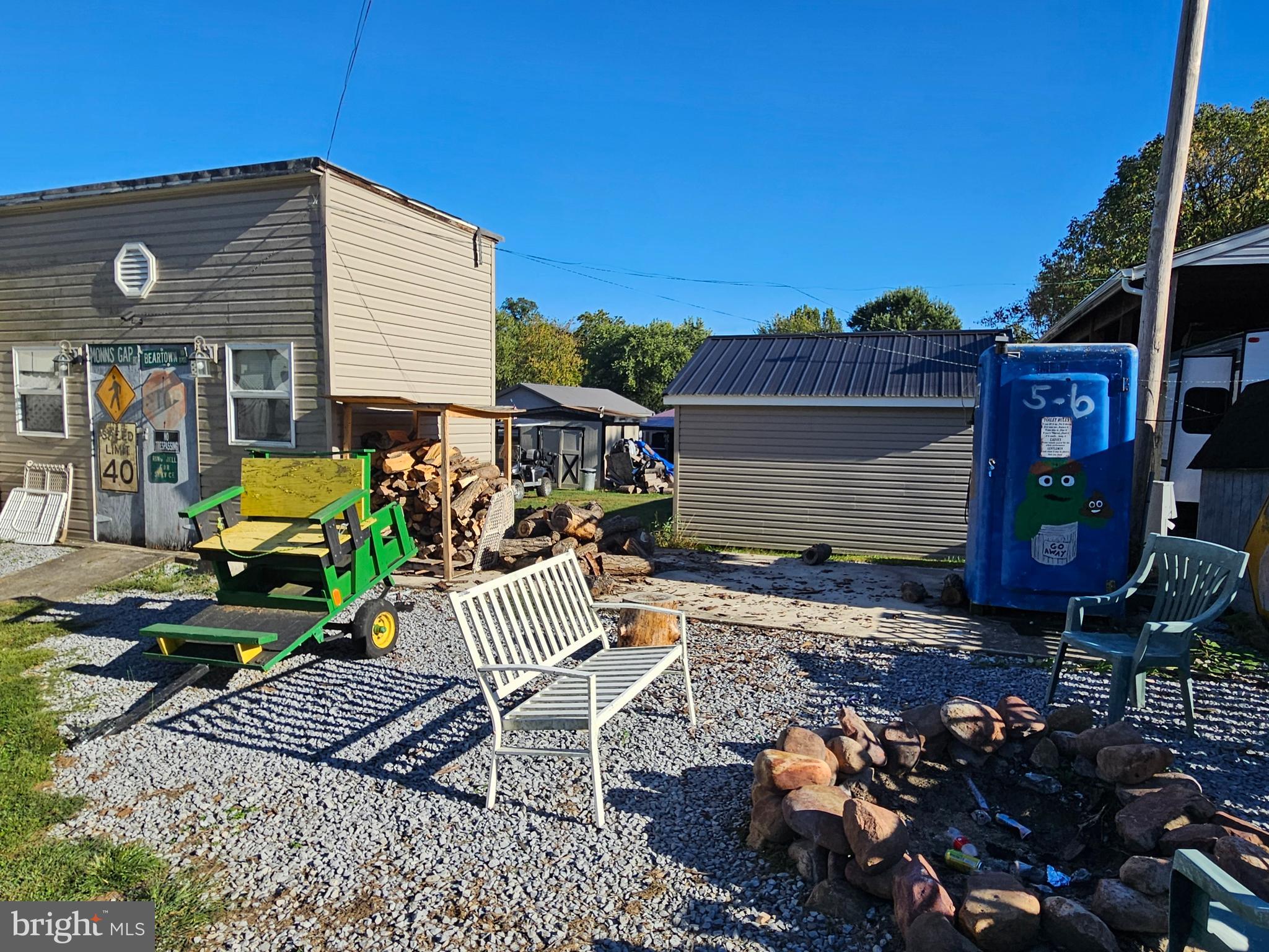 6 And 7 Poison Oak Falling Waters, WV 25419 - Photo 5 of 44 a front view of a house with garden