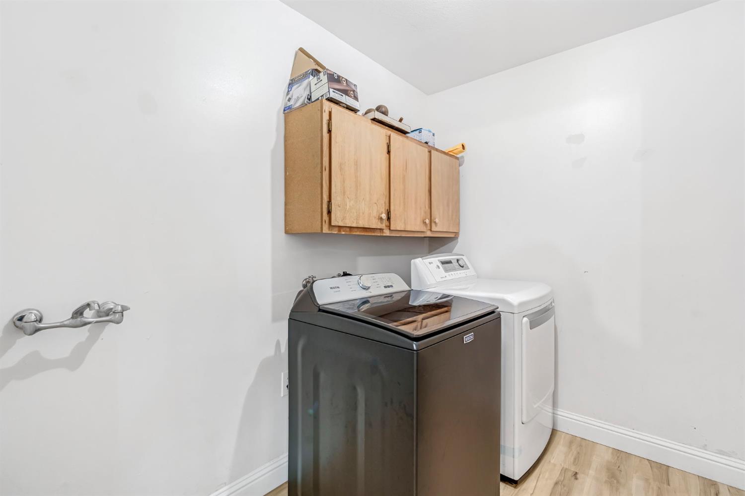 2428 West 3rd Street Madera, CA 93637 - Photo 14 of 39 a utility room with cabinets washer and dryer