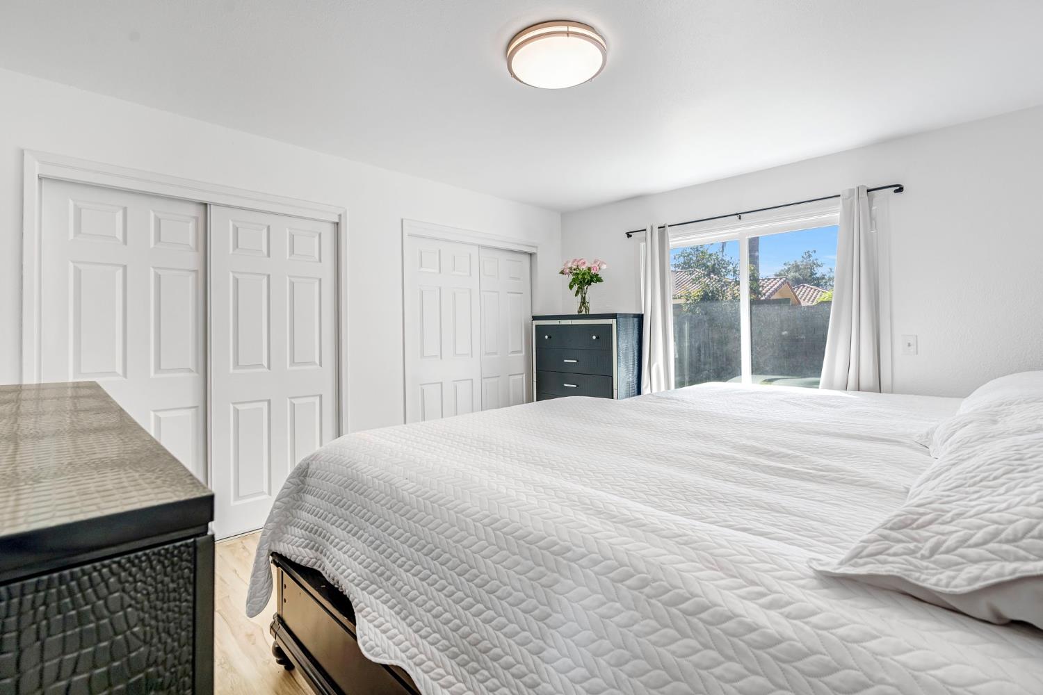 2428 West 3rd Street Madera, CA 93637 - Photo 25 of 39 a bedroom with a bed and a dresser