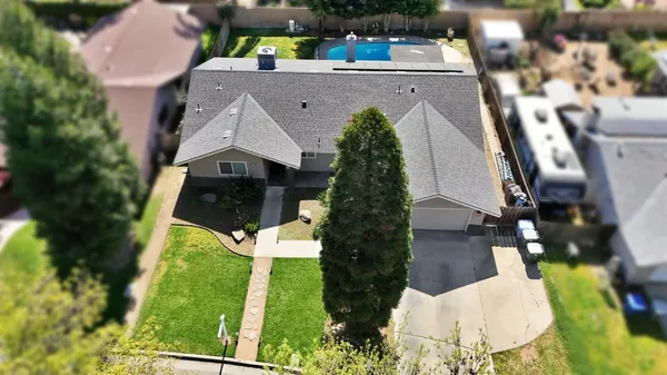 an aerial view of house with yard