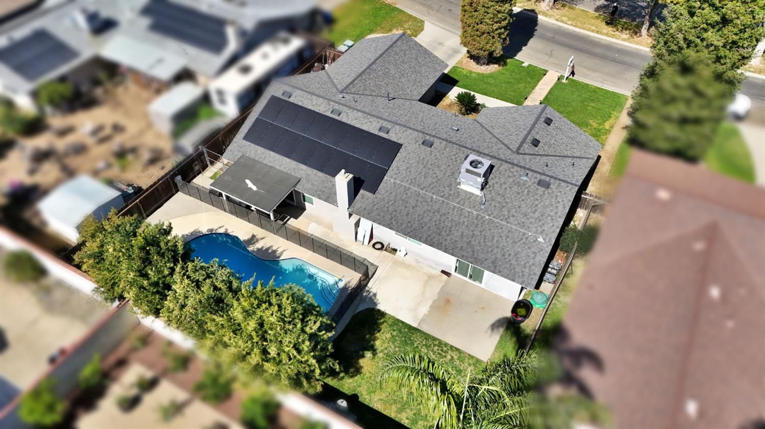 2428 West 3rd Street Madera, CA 93637 - Photo 37 of 39 an aerial view of a house with a yard