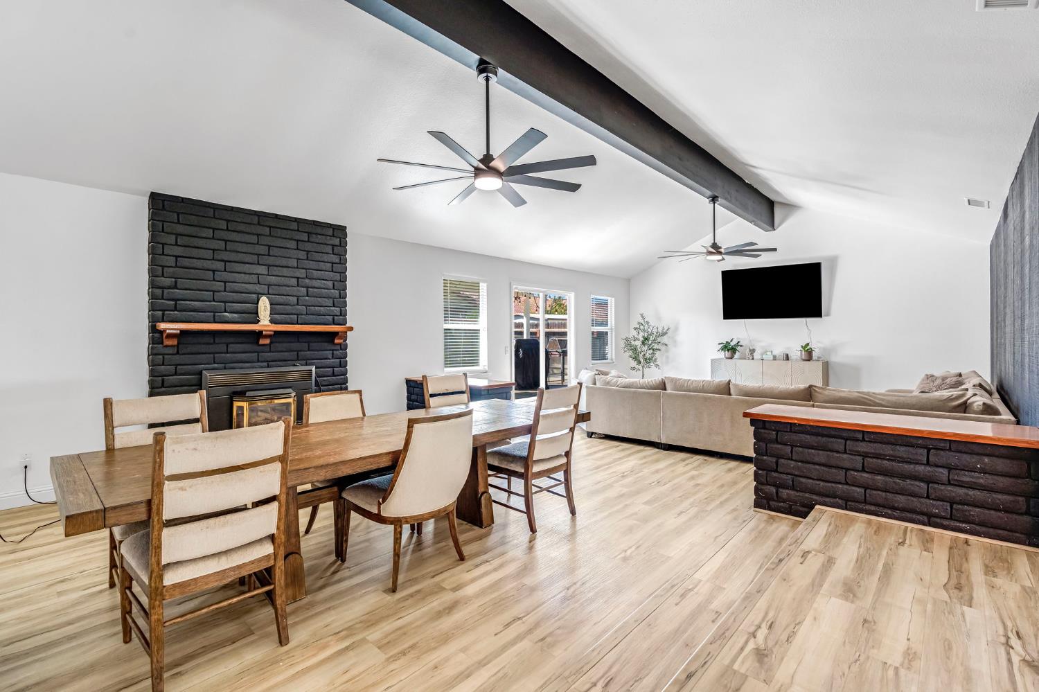2428 West 3rd Street Madera, CA 93637 - Photo 6 of 39 a view of a workspace with furniture window and wooden floor