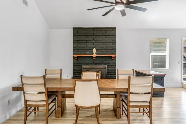 a view of a dining room with furniture window and wooden floor