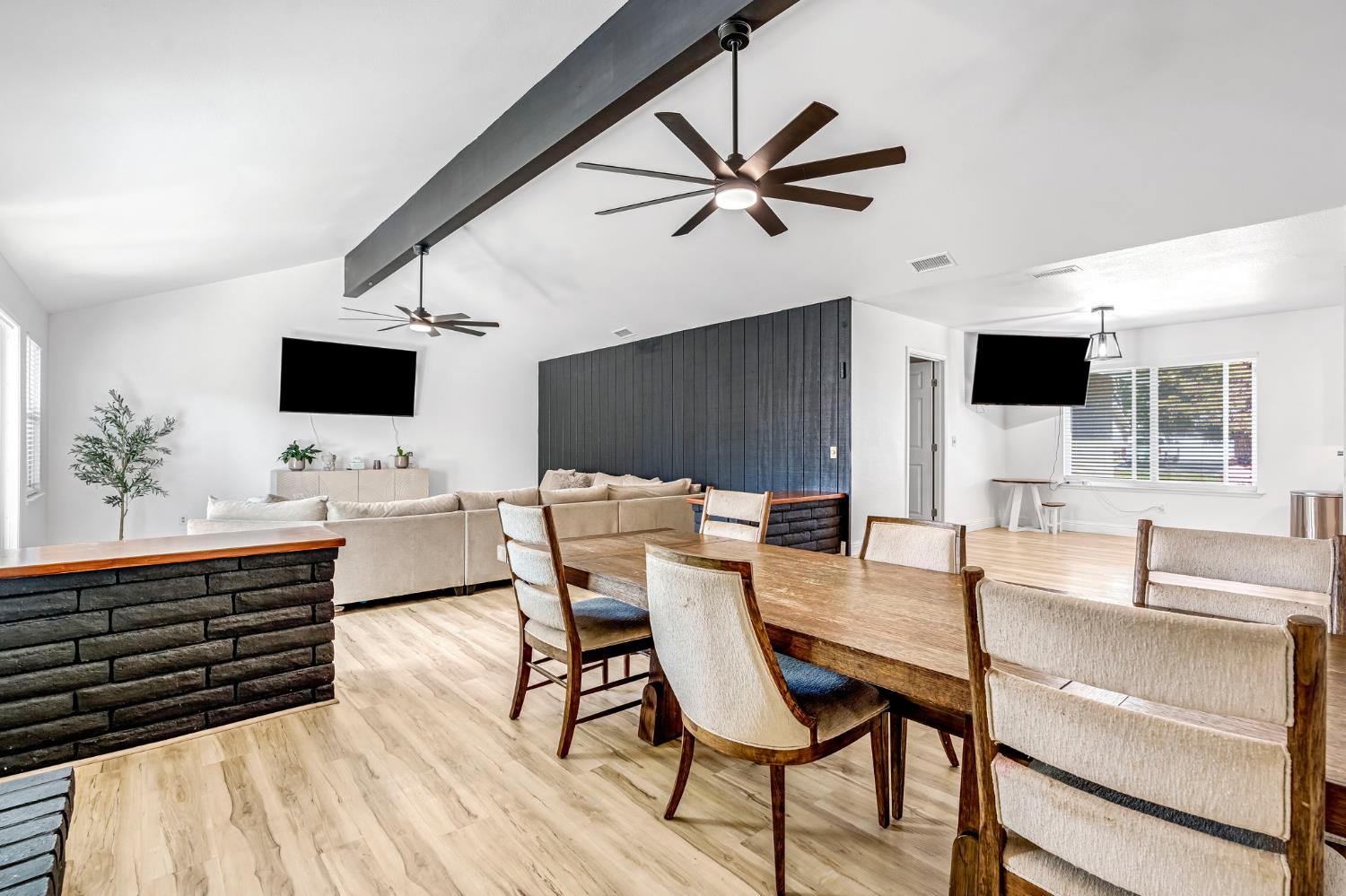 2428 West 3rd Street Madera, CA 93637 - Photo 10 of 39 a view of a livingroom with furniture and a flat screen tv
