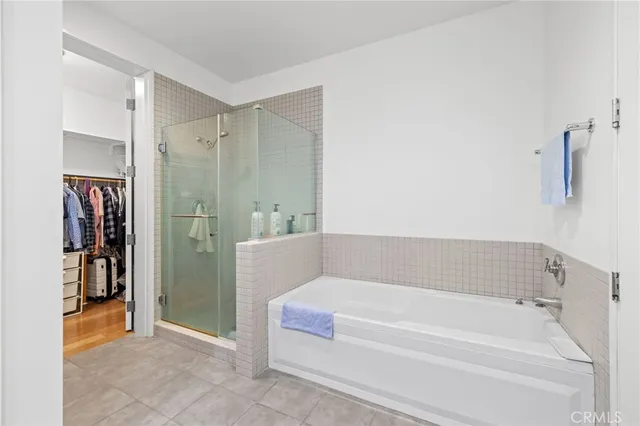 a bathroom with a bathtub and a shower