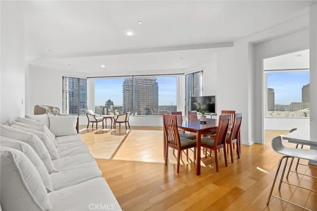 a view of a dining room with furniture window and wooden floor