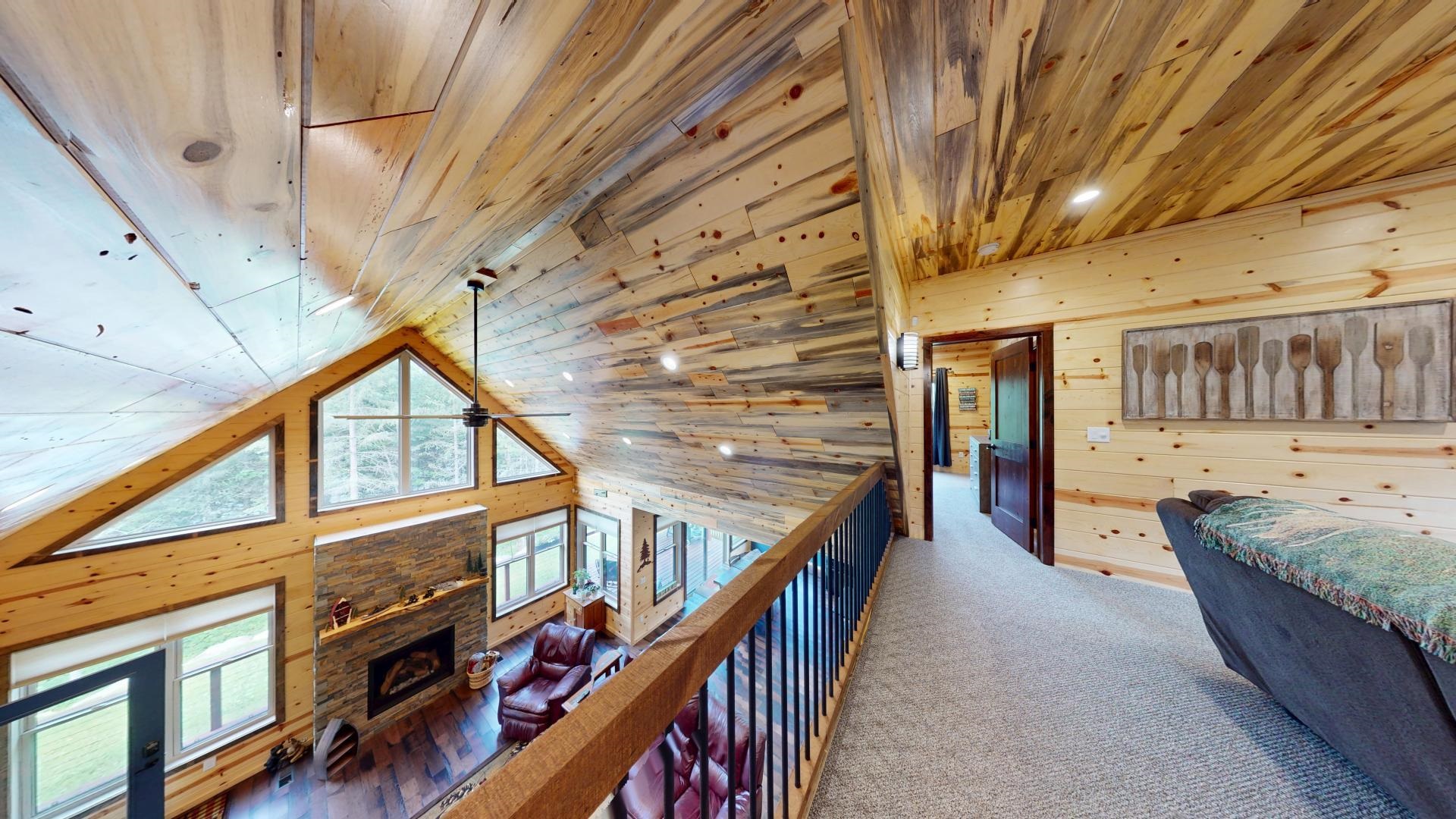 7523 Nelson Road Crane Lake, MN 55725 - Photo 28 of 50 Hall featuring high vaulted ceiling, wood walls, wood ceiling, and carpet flooring