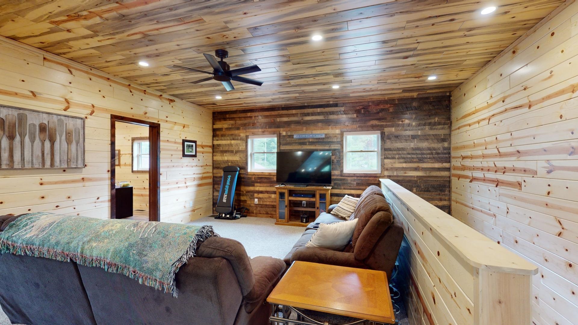 7523 Nelson Road Crane Lake, MN 55725 - Photo 29 of 50 Living area with carpet flooring, wood walls, recessed lighting, a ceiling fan, and wood ceiling