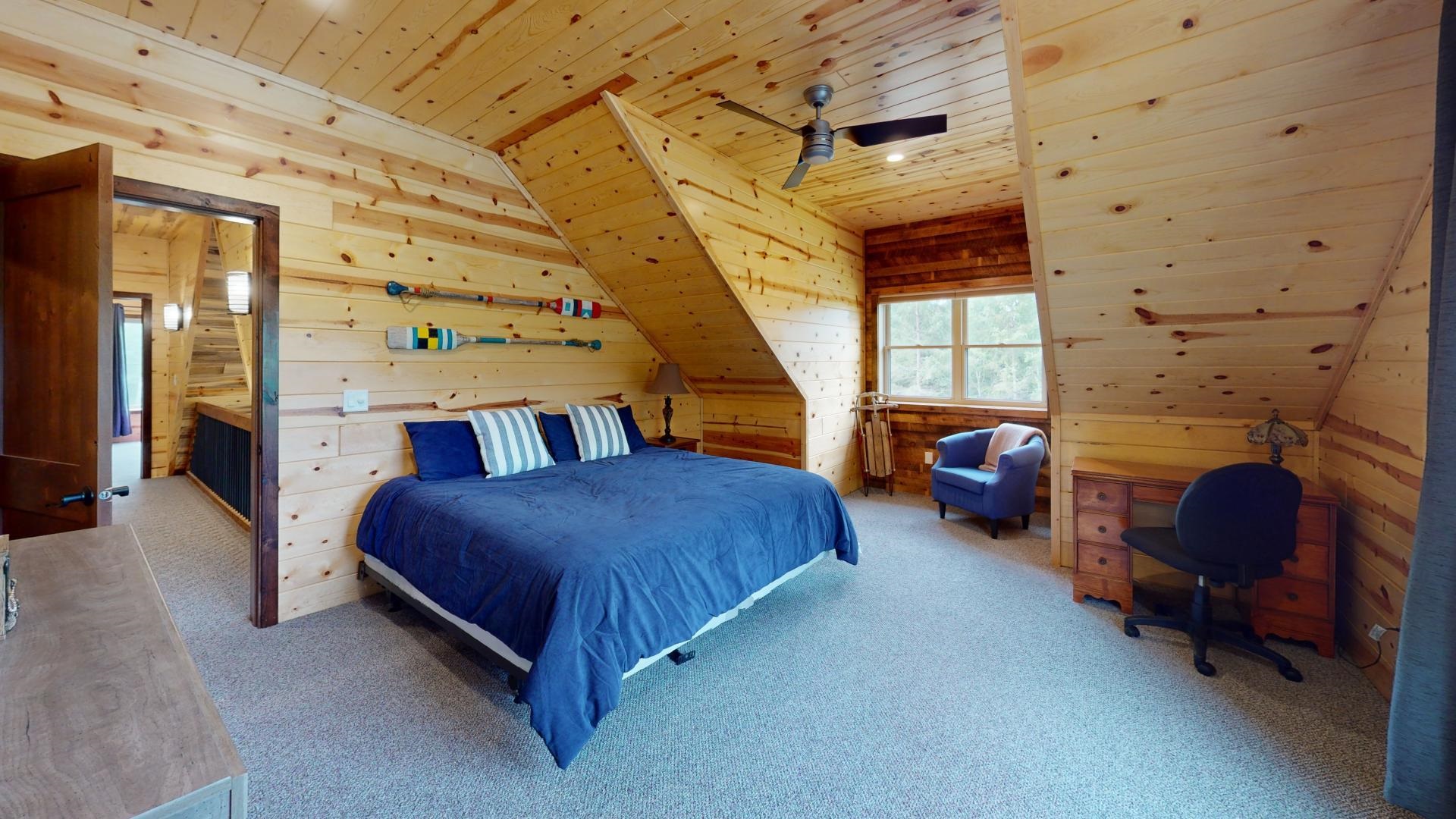 7523 Nelson Road Crane Lake, MN 55725 - Photo 35 of 50 Carpeted bedroom featuring vaulted ceiling, wooden ceiling, and wood walls