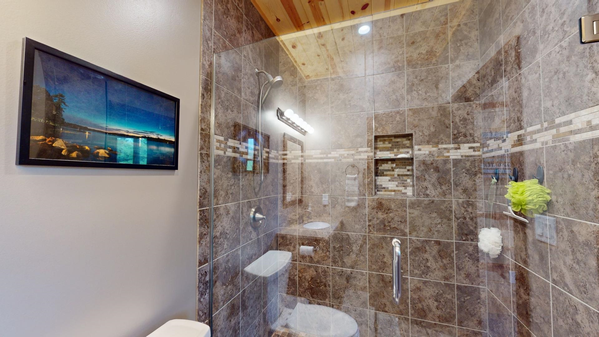 7523 Nelson Road Crane Lake, MN 55725 - Photo 39 of 50 Bathroom featuring a tile shower and toilet