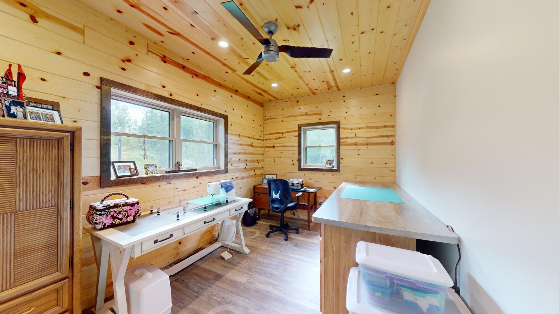 7523 Nelson Road Crane Lake, MN 55725 - Photo 45 of 50 Home office featuring a ceiling fan, wooden ceiling, wooden walls, and light wood-type flooring