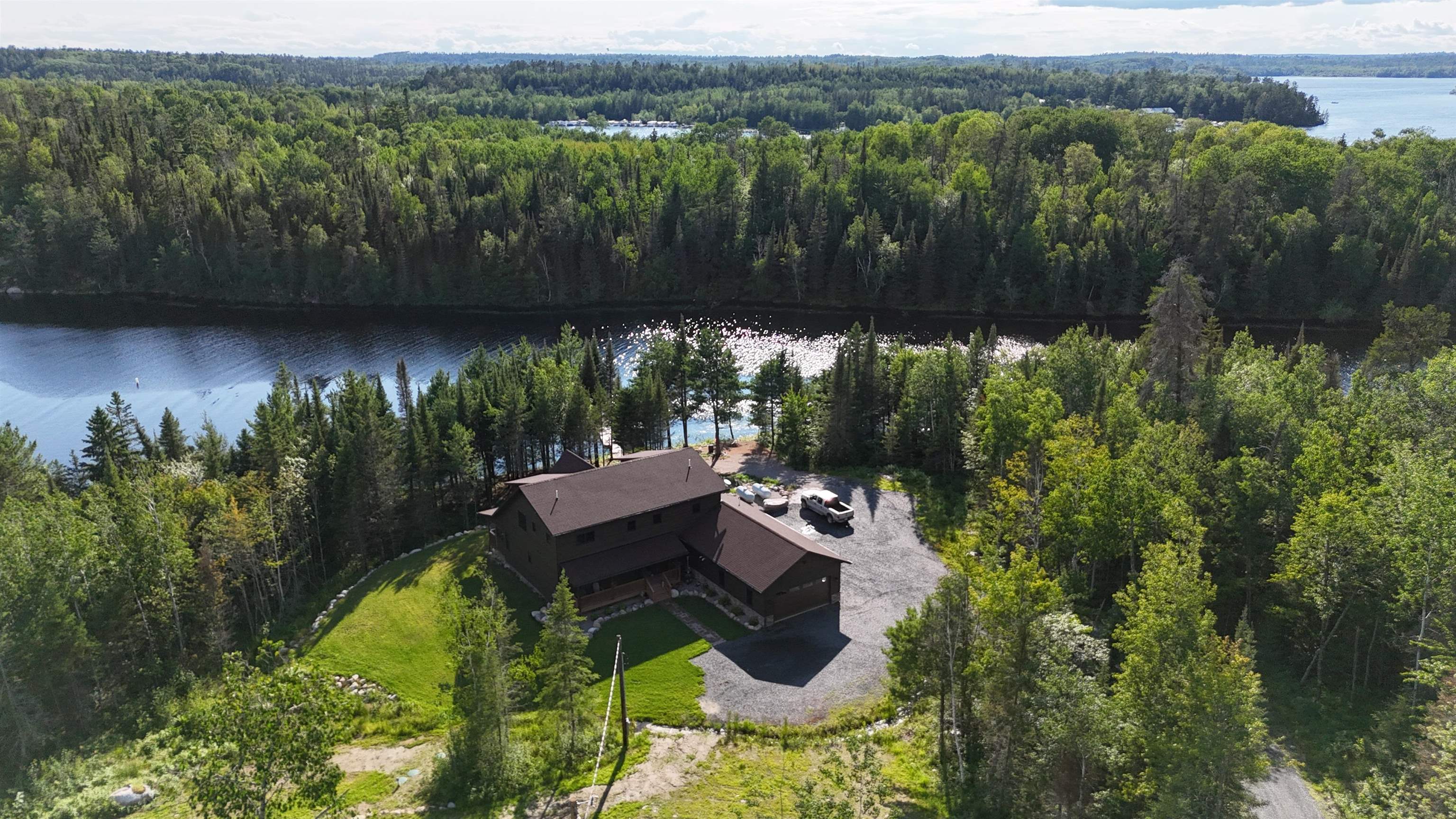 7523 Nelson Road Crane Lake, MN 55725 - Photo 6 of 50 Drone / aerial view with a water view and a view of trees