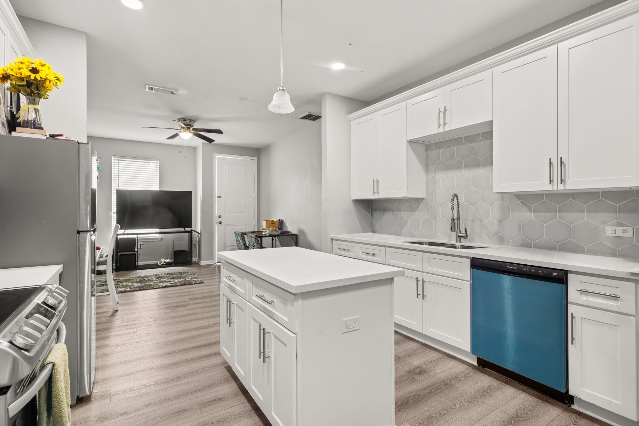 8534 Woodlyn Road Houston, TX 77028 - Photo 13 of 25 a kitchen with a sink and a stove top oven