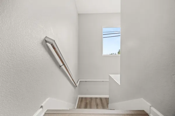 a view of entryway with wooden floor