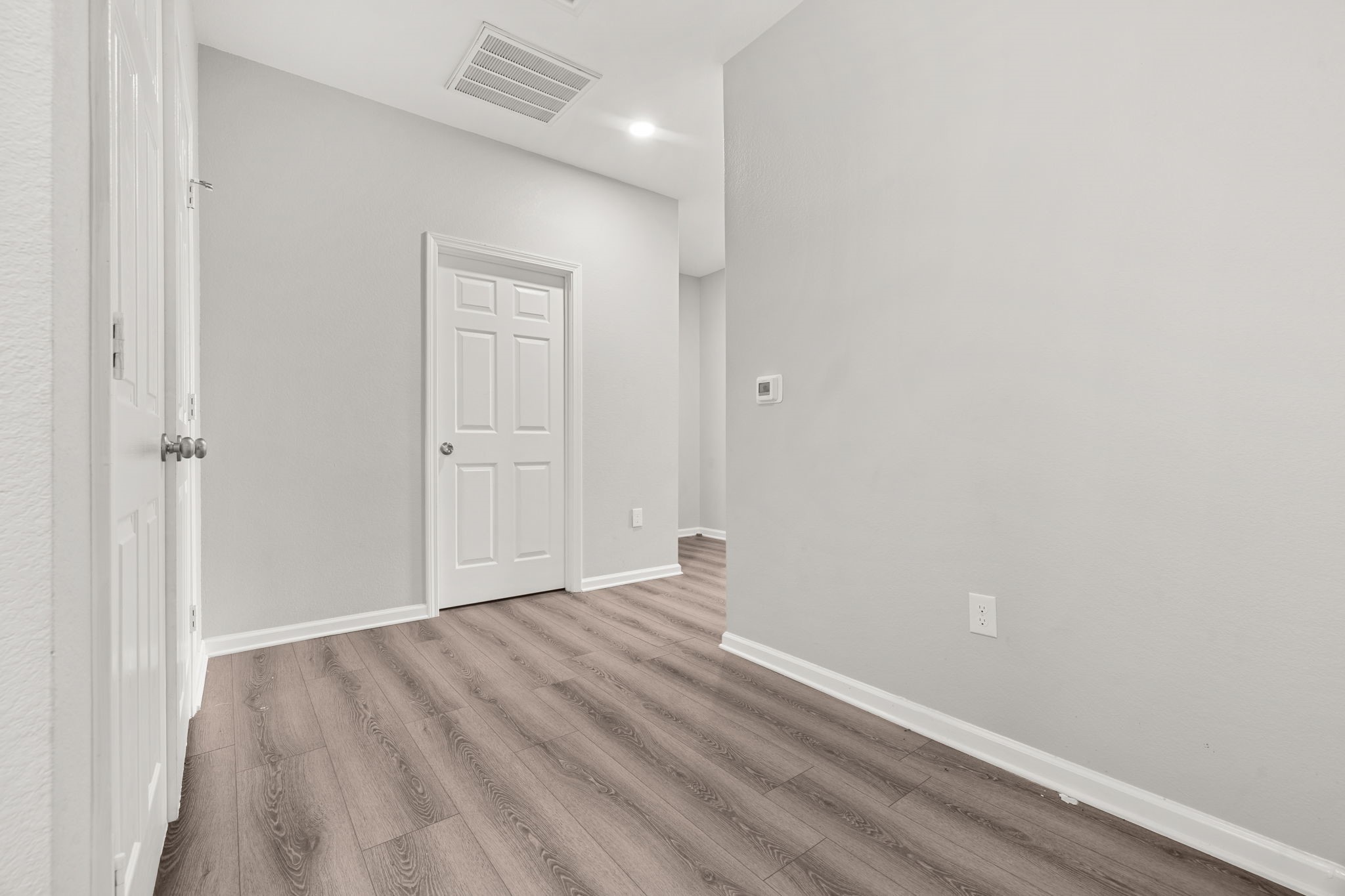 8534 Woodlyn Road Houston, TX 77028 - Photo 18 of 25 wooden floor in an empty room