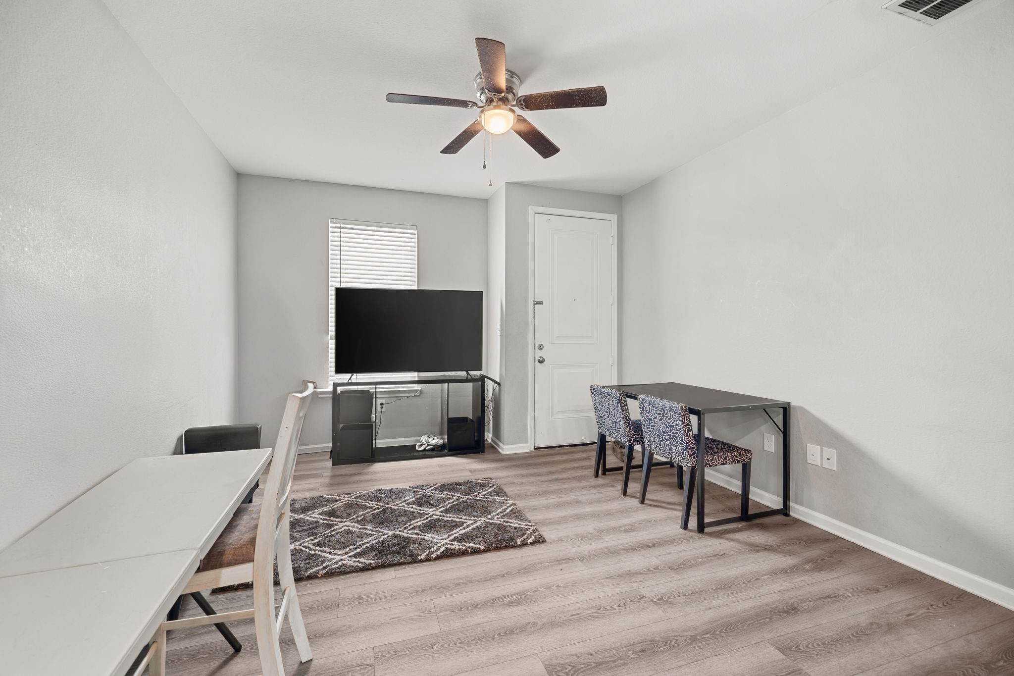8534 Woodlyn Road Houston, TX 77028 - Photo 9 of 25 a living room with furniture and a flat screen tv