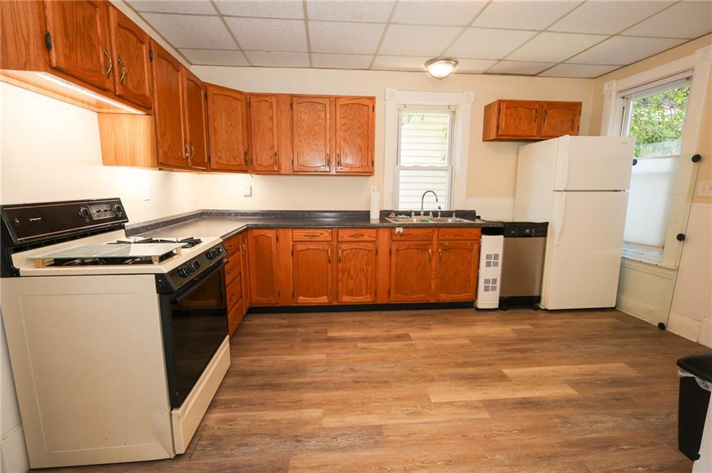 103 Whitestown Road Lyndora, PA 16045 - Photo 15 of 28 a kitchen with stainless steel appliances granite countertop a stove a sink and a refrigerator